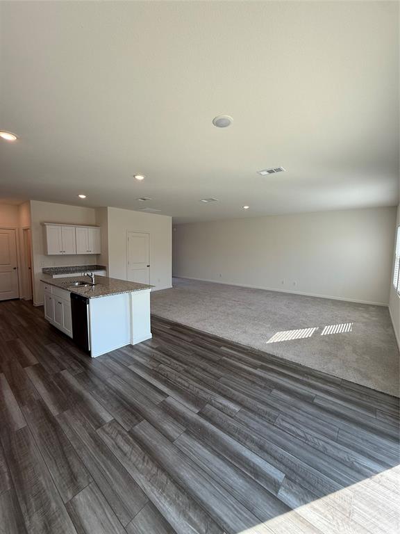 2104 Jackson Street Princeton, TX 75407 - Photo 14 of 15 a view of kitchen with kitchen island microwave and stove