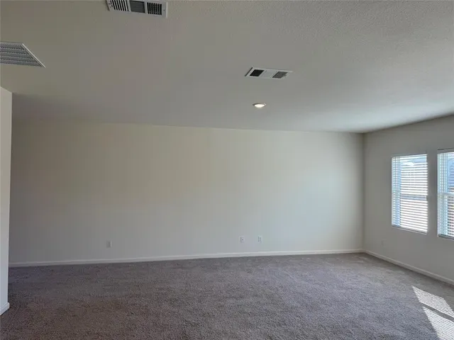 a view of kitchen with kitchen island microwave and stove