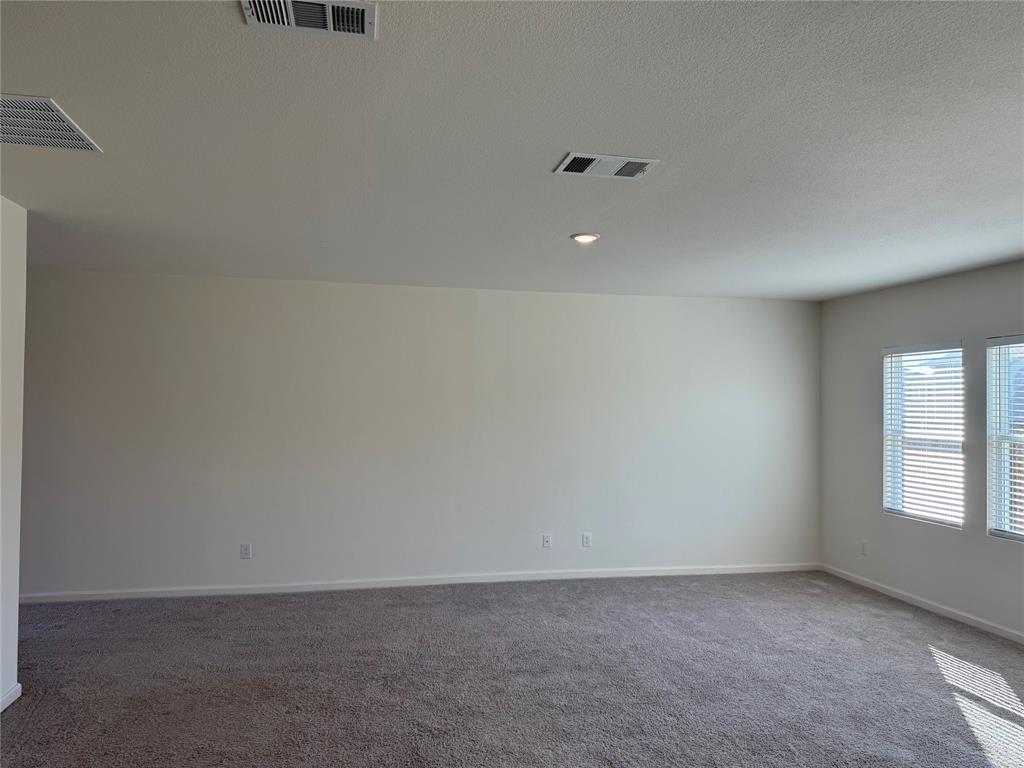 2104 Jackson Street Princeton, TX 75407 - Photo 3 of 15 an empty room with windows