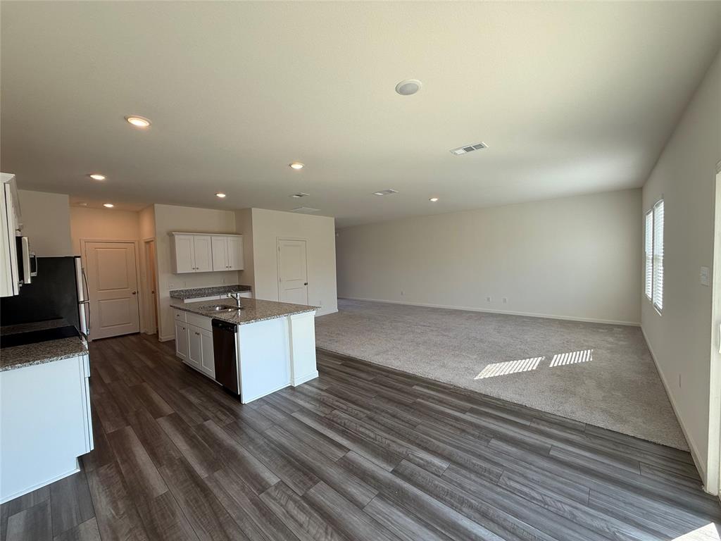 2104 Jackson Street Princeton, TX 75407 - Photo 15 of 15 a view of kitchen with sink microwave and stove