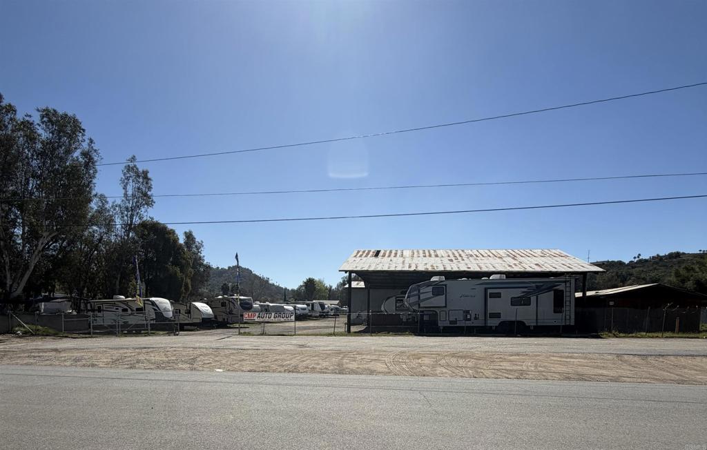 27455 Valley Center Road Valley Center, CA 92082 - Photo 3 of 4 a front view of a house with a yard and garage