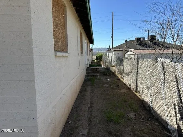 a view of a pathway of a house with a yard