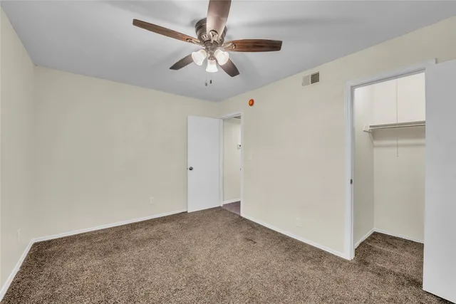a view of a big room with carpet