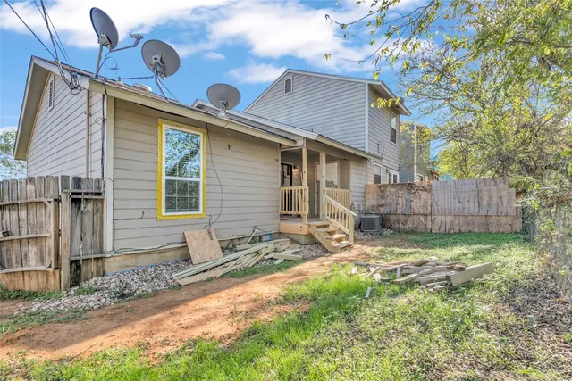 a backyard of a house with garden and patio