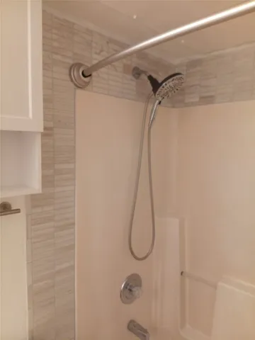a bathroom that has a shower sink
