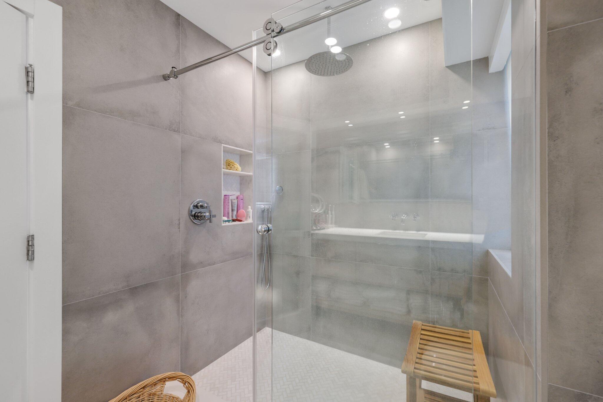 100 Southeast 5th Avenue, Unit 106 Boca Raton, FL 33432 - Photo 29 of 81 a bathroom with a shower