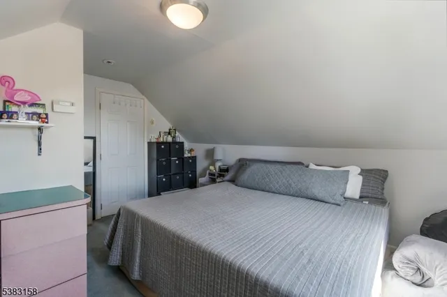 a bedroom with a bed and closet