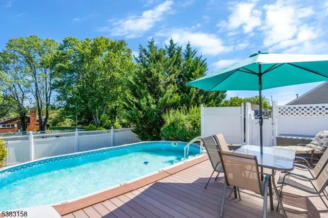a view of backyard with seating and green space
