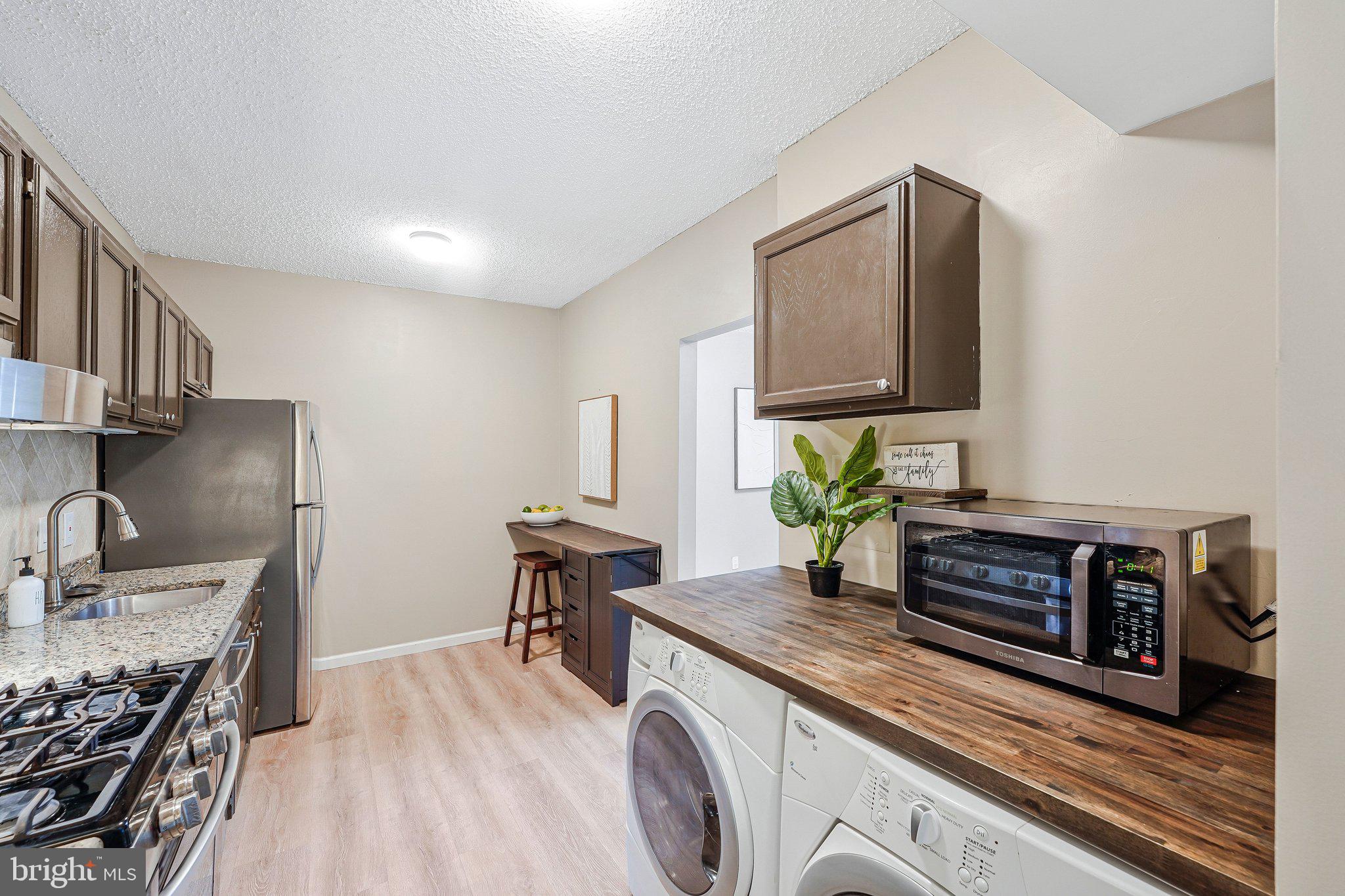 11804 Breton Court, Unit 1A Reston, VA 20191 - Photo 13 of 19 In-Unit Laundry
