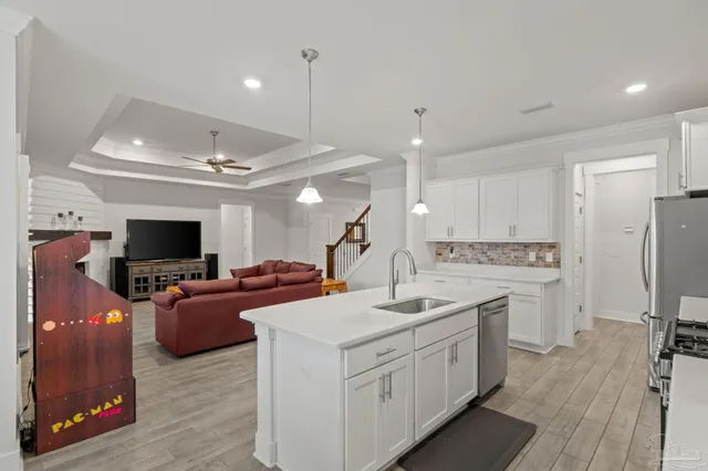 a kitchen with a sink stove and refrigerator