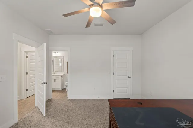 a bed room with a bed and a window