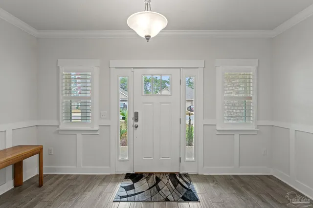 a view of entryway with wooden floor