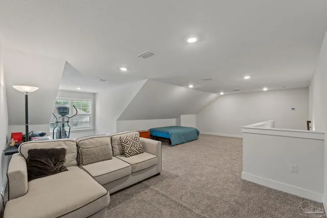 a view of a room with furniture and window