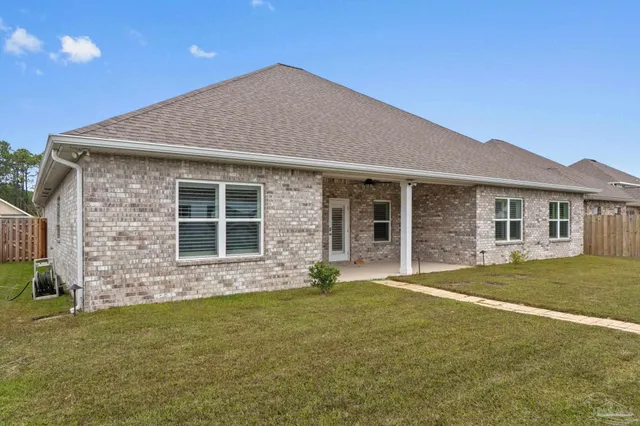 an aerial view of houses with outdoor space
