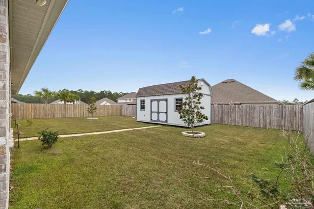 an aerial view of a house with a swimming pool