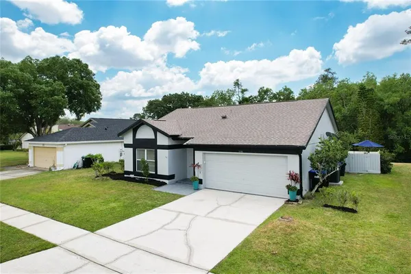 a view of a house with a yard patio and deck