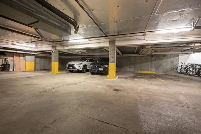 a view of parking garage with cars