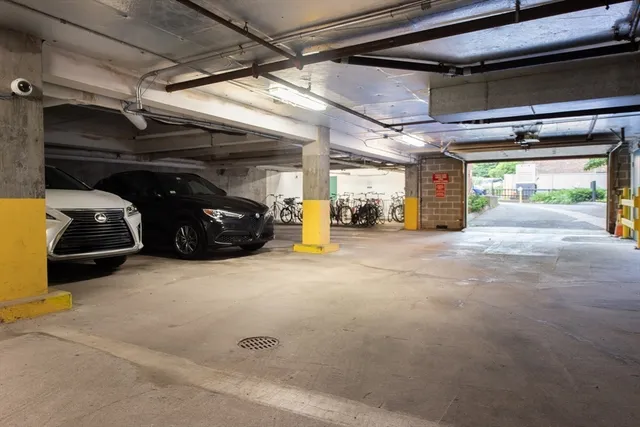 a view of parking garage with cars