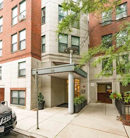 a front view of a building with potted plants