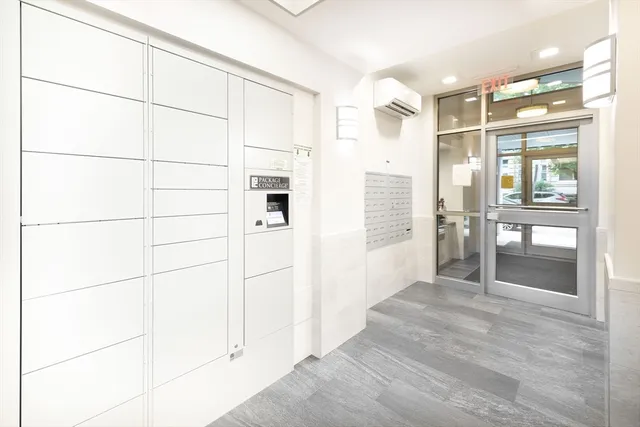 a bathroom with a shower and a glass door