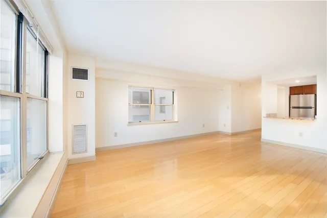 a view of an empty room with a window