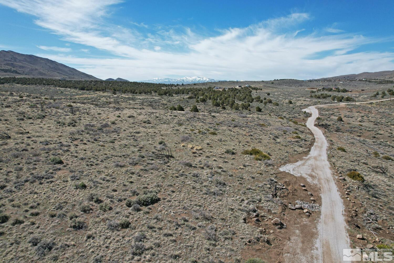 0 Mask Lane Reno, NV 89508 - Photo 3 of 10 a view of a dry yard with mountains in the background