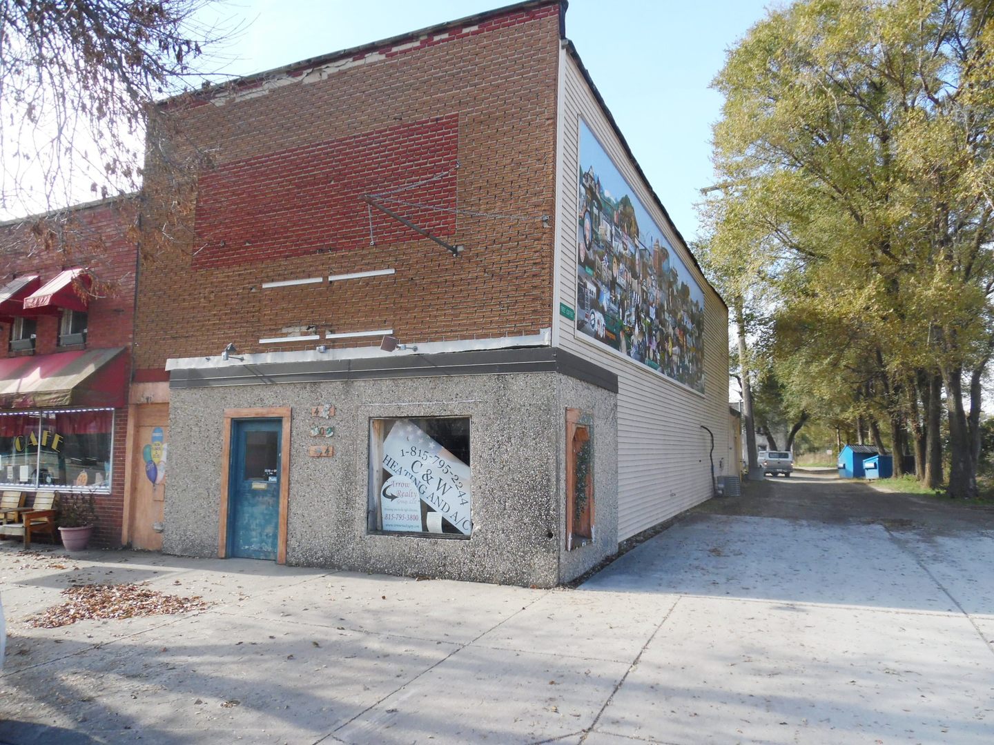 a front view of a building with parking
