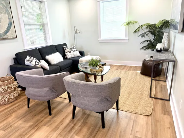 a living room with furniture and a window