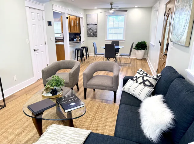 a view of a dining room with furniture and wooden floor