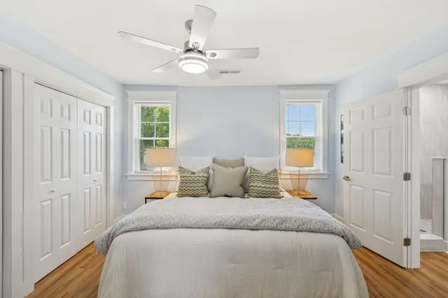 a bedroom with a bed and walk in closet