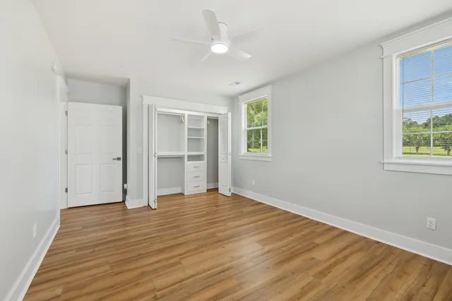 a view of a lake with houses in the background
