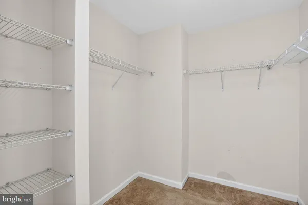 a view of an empty walk in closet