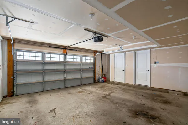 a view of an empty room with windows