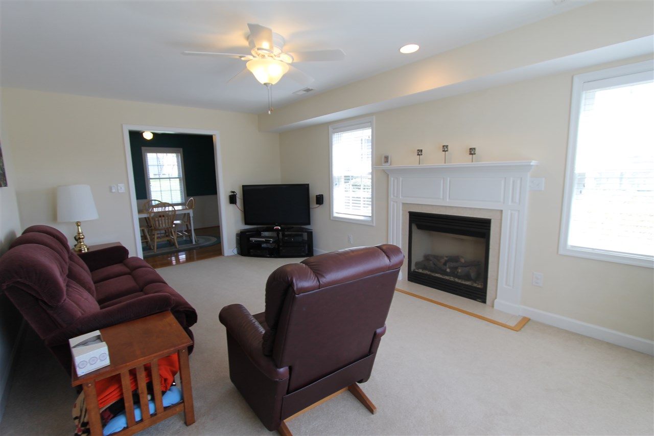 796 Ladd Road Waynesboro, VA 22980 - Photo 17 of 36 a living room with furniture a fireplace and a flat screen tv