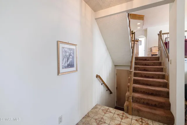 a view of staircase with white walls