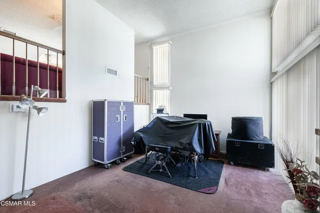 a view of a livingroom with furniture and a window