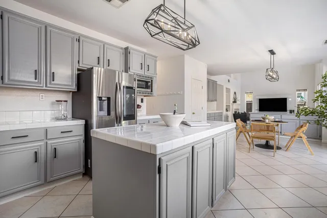 a view of a workspace with furniture