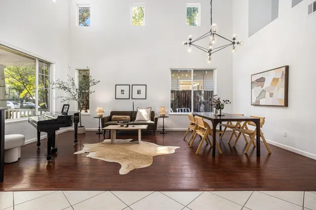 a living room with fireplace furniture and a wooden floor