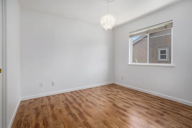 a bathroom with a double vanity sink mirror and bathtub
