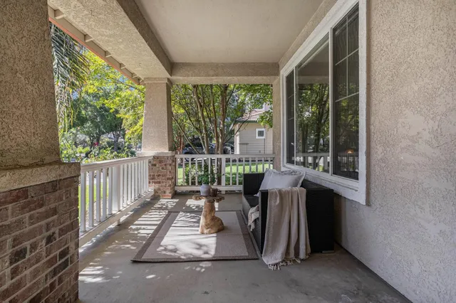 a view of two chairs in the balcony