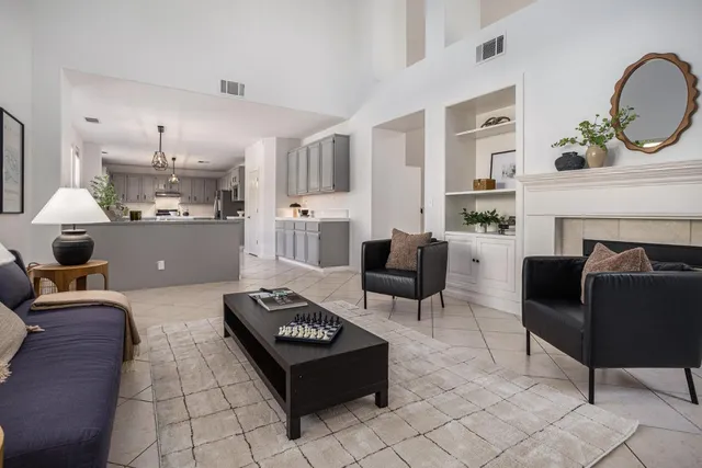 a living room with furniture and a fireplace