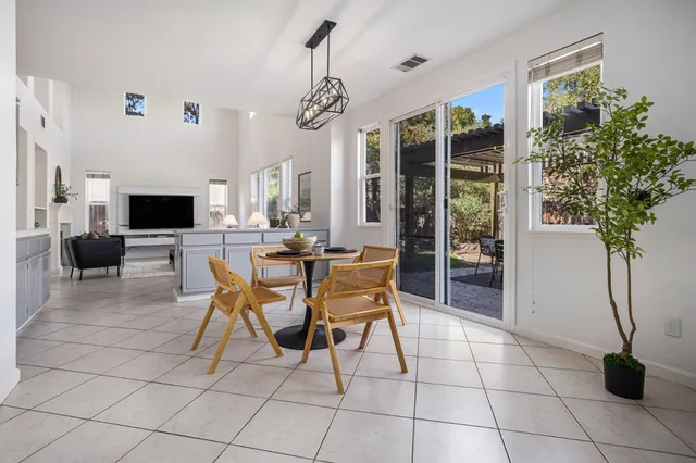 a kitchen with stainless steel appliances a refrigerator sink and microwave