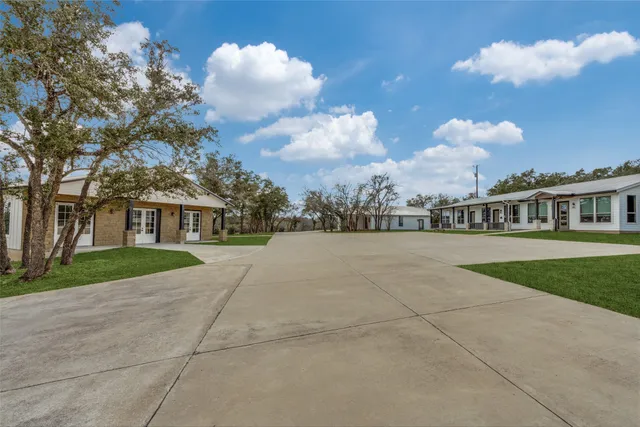 a view of house with a yard