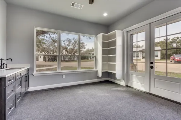 a view of an empty room with a large window