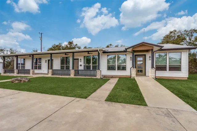 front view of a house with a yard