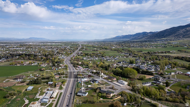 4155 Johnson Road Nibley, UT 84321 - Photo 67 of 71 Aerial perspective of suburban area with a mountainous background