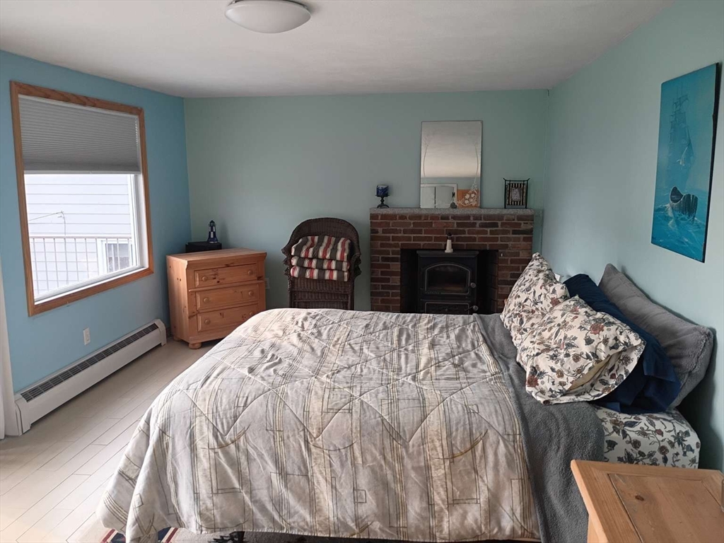 6 Tilden Avenue Scituate, MA 02066 - Photo 16 of 34 a bedroom with a bed and dresser with mirror