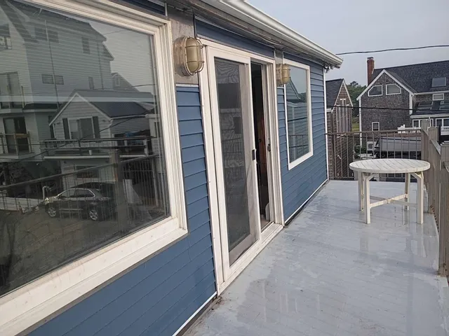 a view of a balcony with a patio