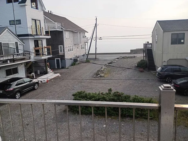 a view of a street with cars