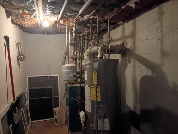 a view of storage and utility room with racks on the wall